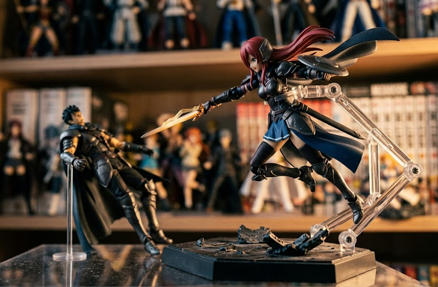 Dynamic anime figure supported by a clear arm stand with a leaning figure stabilized by a rod support